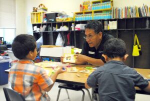United Way of Northern Arizona President & CEO Steve Peru reads to children during a KinderCamp program. Courtesy photos.